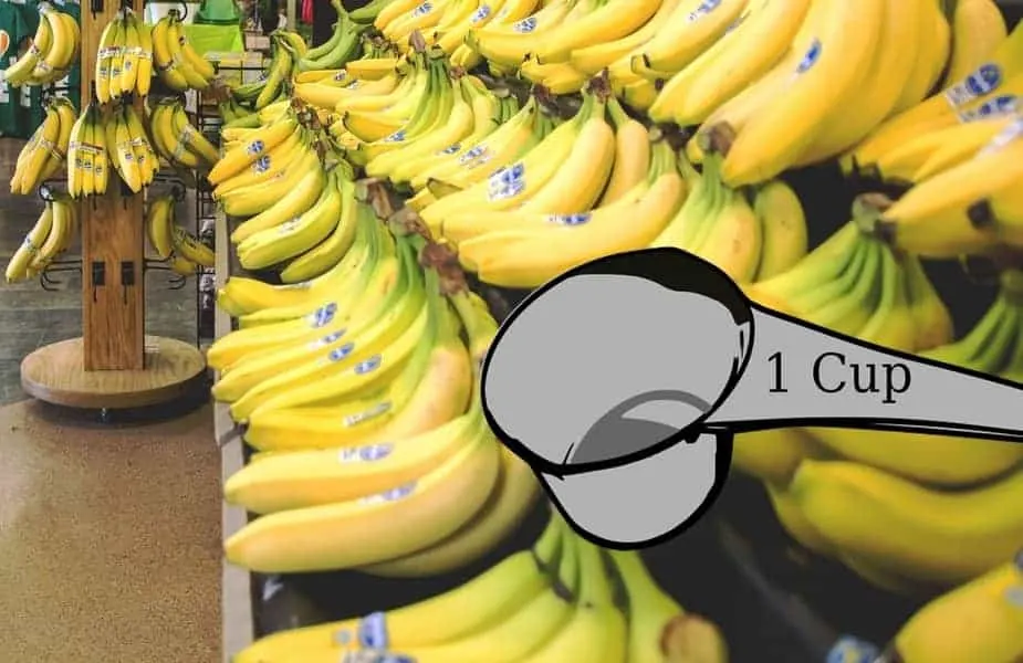 Measuring Cup in Front of Bananas in a Grocery Store
