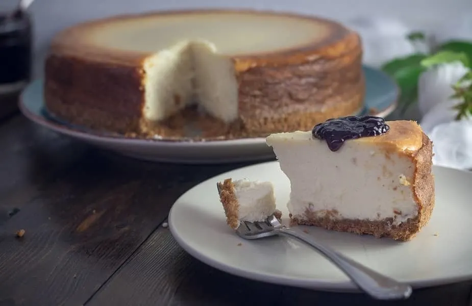 Piece of Cheesecake on a Plate with Blueberry Topping