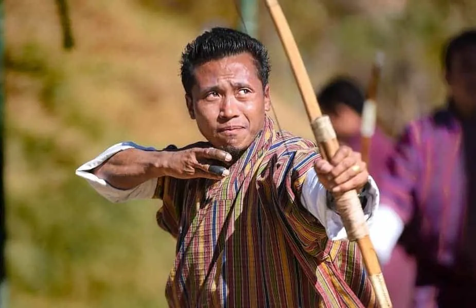 Man Shooting Hand-Crafted Bow