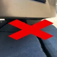 Car-About-to-Hit-Curb-From-Side-Angle-With-Red-X