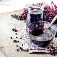 Elderberry-Syrup-in-a-Decanter-and-a-Bowl