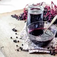 Elderberry-Syrup-in-a-Decanter-and-a-Bowl