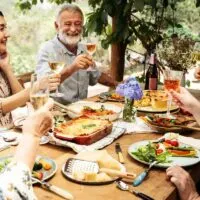Friends-Having-an-Outdoor-Lasagna-Dinner