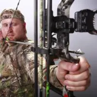 Hunter Aiming a Compound Bow With a Fixed Broadhead