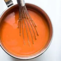 Pot-of-Tomato-Soup-With-a-Whisk-in-it