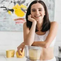 Sporty-Girl-with-Elbow-on-Blender