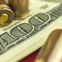 Three-Ammo-Rounds-on-Hundred-Dollar-Bills