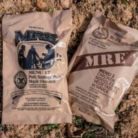 Two MRE Meals Ready to Eat Laying on the Ground