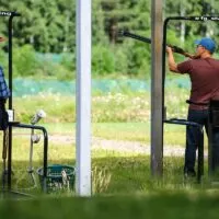 Two men practicing at a shooting range