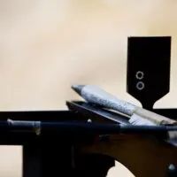 Crossbow ready to shoot into blurred background