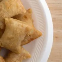 Top view of a serving of pizza rolls on a foam plate