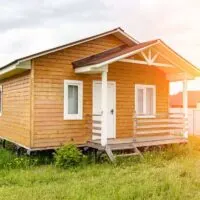 A small wooden frame house with a porch