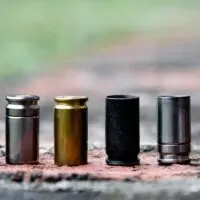 Several 9mm cases on a brick floor