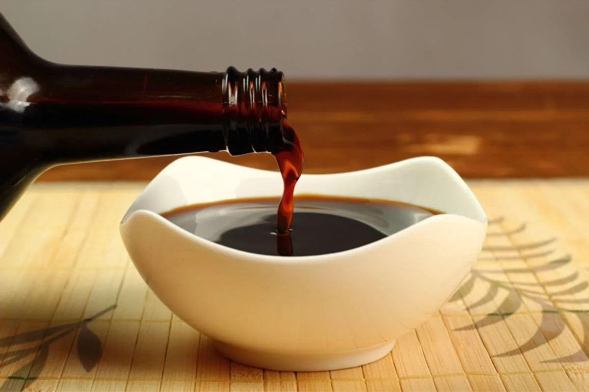 Kecap manis being poured into a bowl
