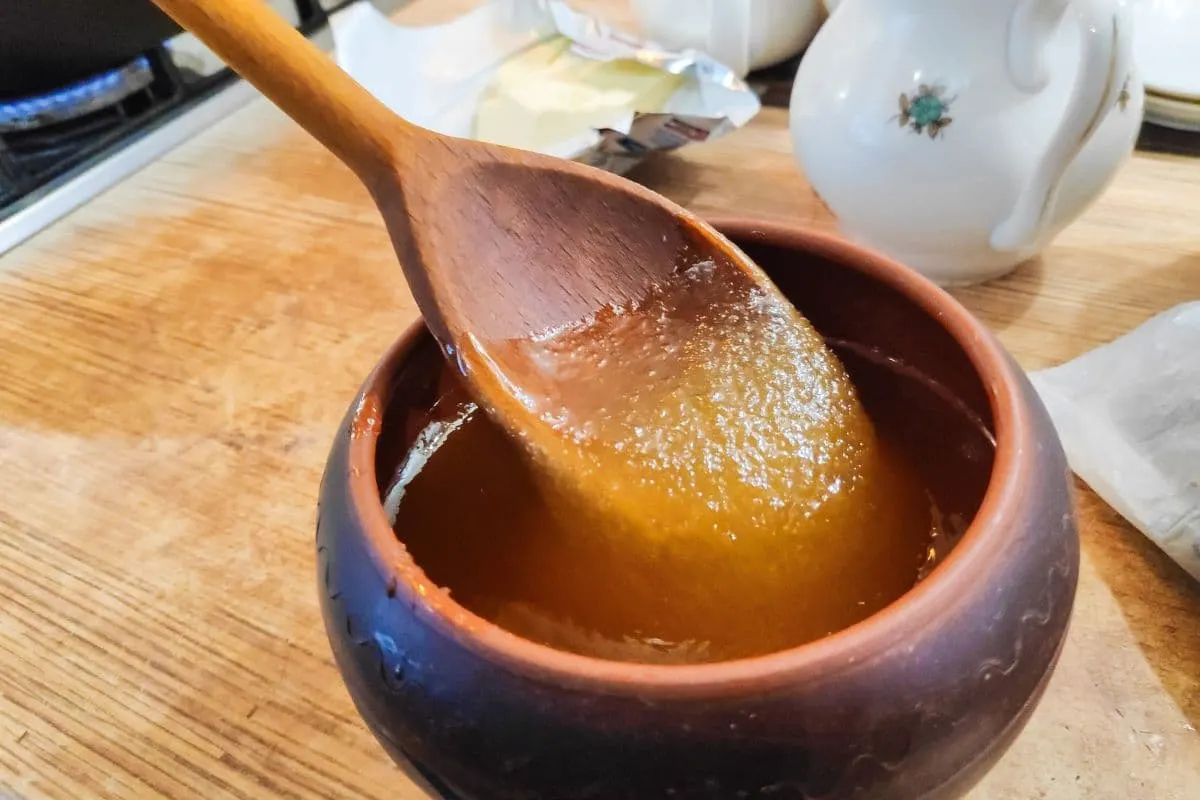 A bowl of grainy or cystalized honey